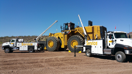 Two_Maintainer_trucks_with_mining_equipment.jpg