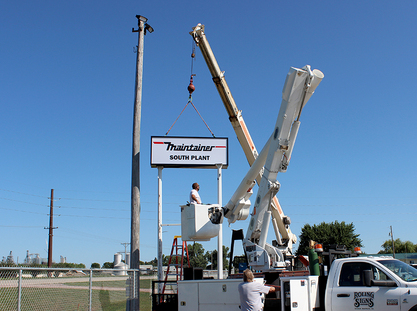 installing_south_plant_sign.jpg